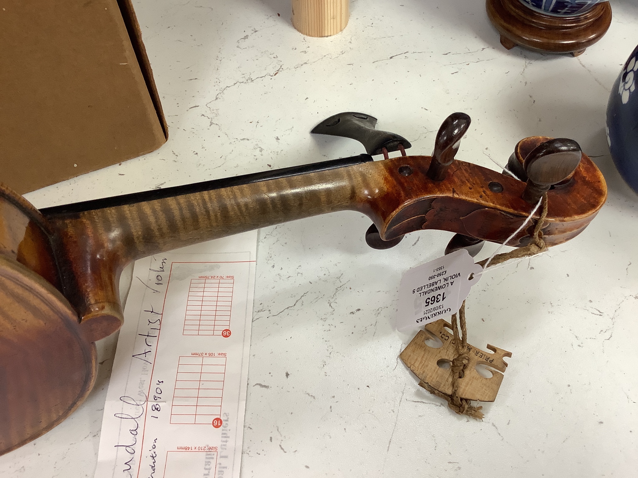 A Lowendall violin, labelled Stradivarius, 58cm long, together with a bow